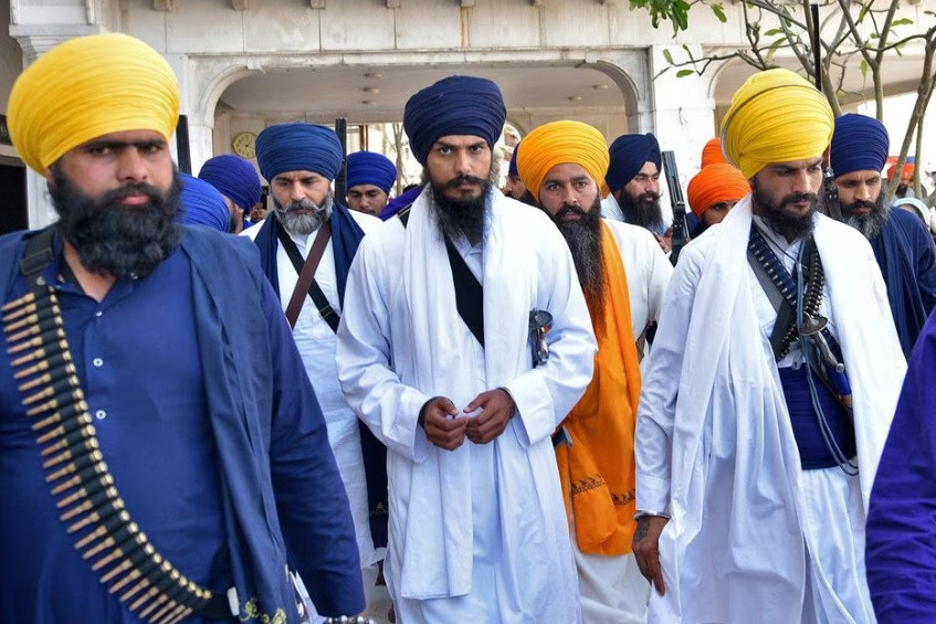 amritpal singh a radical sikh leader leaves the holy sikh shrine of the golden temple along with his supporters in amritsar india march 3 2023 reuters stringer