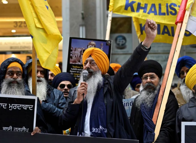 a demonstrator uses a microphone as others hold flags and signs as they protest outside india s consulate in vancouver british columbia canada september 25 2023 photo reuters a demonstrator uses a microphone as others hold flags and signs as they protest outside india s consulate in vancouver british columbia canada september 25 2023 photo reuters