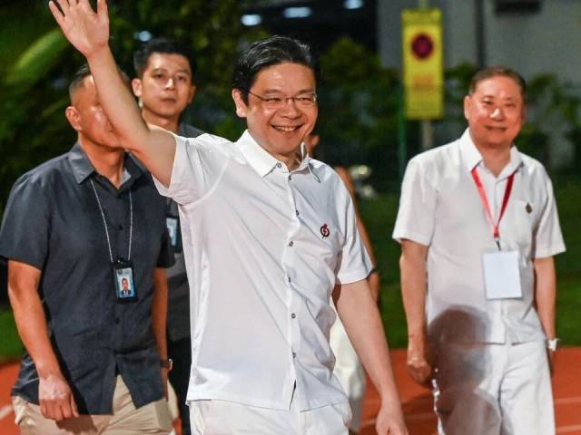 singapore s prime minister lawrence wong of the people s action party pap arrives at the party s gathering awaiting the vote count for the general election in singapore on may 3 2025 photo afp singapore s prime minister lawrence wong of the people s action party pap arrives at the party s gathering awaiting the vote count for the general election in singapore on may 3 2025 photo afp