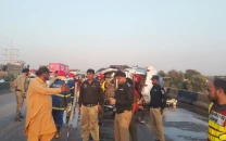 at least 13 killed as oil tanker collides with bus on m 9 motorway near karachi police