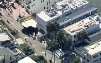 evacuations in la neighbourhood after waves open sinkhole