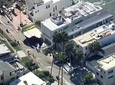 evacuations in la neighbourhood after waves open sinkhole