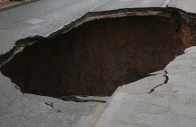 three motorbikes fall into sinkhole