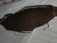 three motorbikes fall into sinkhole