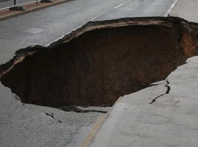 three motorbikes fall into sinkhole three motorbikes fall into sinkhole