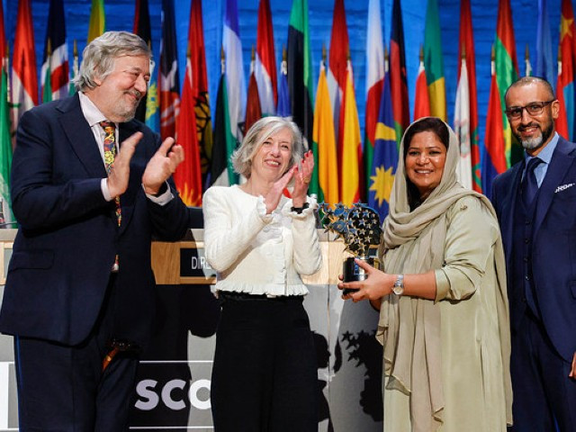 pakistani teacher riffat arif aka sister zeph 3rdl poses with her award of winner of the varkey foundation global teacher prize next to english actor broadcaster comedian director narrator and writer stephen fry l unesco assistant director general for education stefania giannini and ceo of gems education firm dino varkey r at the unesco headquarters in paris on november 8 2023 photo afp