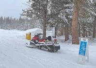 a snowmobile is parked at alder creek adventure center one of two sites where search crews were launched to try to locate a group of missing skiers photo reuters