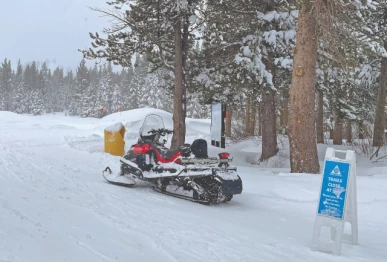 a snowmobile is parked at alder creek adventure center one of two sites where search crews were launched to try to locate a group of missing skiers photo reuters