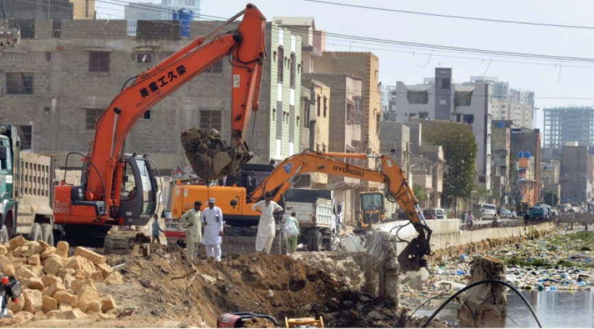 demolition drive officials use heavy machinery to clean and extend the qayyumabad drain ahead of next monsoon season photo express