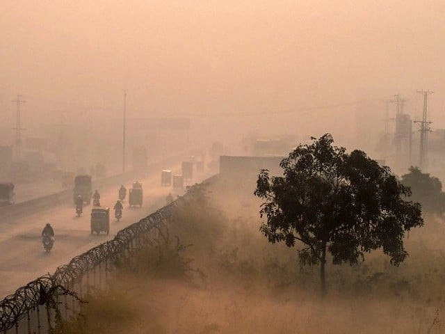 an aerial shot shows people commute along a street amid heavy smoggy conditions in lahore photo afp file an aerial shot shows people commute along a street amid heavy smoggy conditions in lahore photo afp file