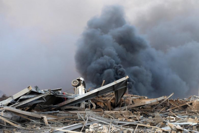 smoke and wreckage witnessed at the explosion at beirut port which left at least a 100 dead a toll that officials expect will rise photo reuters