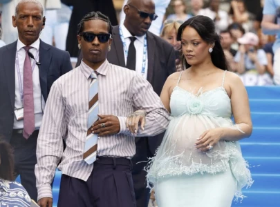 rihanna debuts baby bump in custom chanel at smurfs premiere in brussels