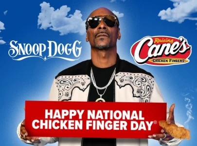 snoop dogg serves fans chicken and albums at raising cane s snoop dogg serves fans chicken and albums at raising cane s