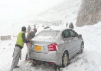workers push a stranded car along a snow covered road in abbottabad after the region received its first snowfall of the season photo ppi workers push a stranded car along a snow covered road in abbottabad after the region received its first snowfall of the season photo ppi