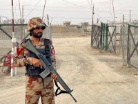 an army soldier stands guard at a deserted entry point at the friendship gate following the exchanges of fire between pakistan and afghanistan forces at the border crossing between the two countries in chaman pakistan february 27 2026 picture taken with a mobile phone reuters abdul khaliq achakzai