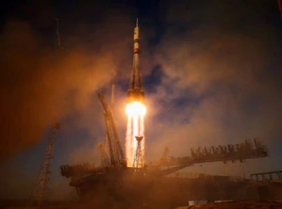 russia sends american and two cosmonauts to space station with rare nasa chief visit