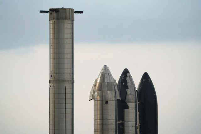 spacex test fires starship booster in milestone for debut orbital launch spacex test fires starship booster in milestone for debut orbital launch