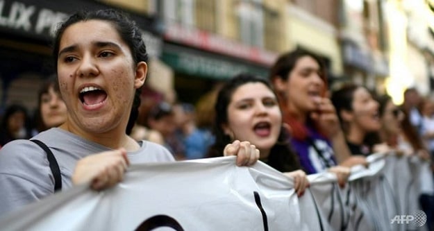 Large crowds of mainly women marched in cities across Spain. PHOTO: AFP