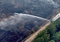 scorched earth a drone view shows belgian army firefighters using a truck to spray burnt fields and forests during a wildfire burning near waimes in the high fens hautes fagnes region photo reuters
