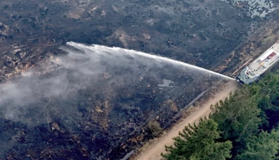 scorched earth a drone view shows belgian army firefighters using a truck to spray burnt fields and forests during a wildfire burning near waimes in the high fens hautes fagnes region photo reuters