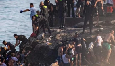 spain urges calm after anti migrant clashes