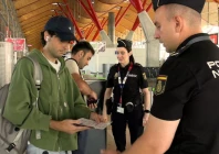 spanish national police officers check the documents of travellers arriving from italy after spain s government said it would establish border controls for flights and ships from italy until september 7 in a dispute over irregular migration at madrid barajas airport in madrid spain august 8 2026 photo reuters