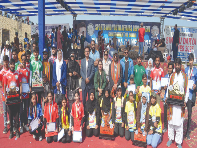 winners of sindhu river games 2025 pose with guests and organisers at the concluding ceremony on sunday on the banks of indus river near hyderabad photo app