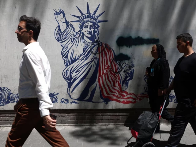 people walk past an anti us mural on a street in tehran iran june 1 reuters people walk past an anti us mural on a street in tehran iran june 1 reuters