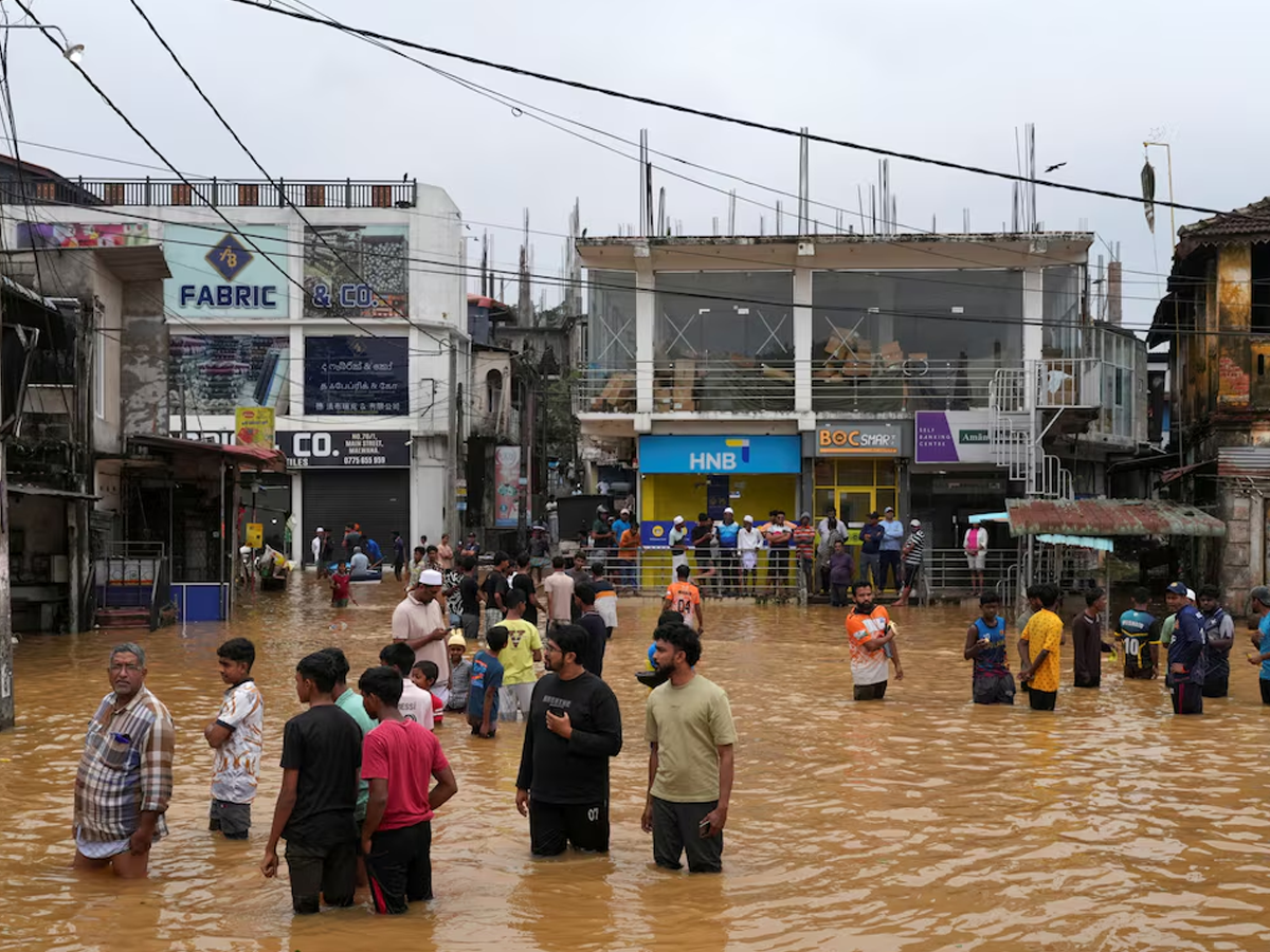 People gather at an area affected by floods, following heavy rainfall in Malwana, Sri Lanka, November 29, 2025. Photo: Reuters