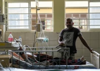 a dengue patient lies on the hospital bed while his son stands next to him at district general hospital in negombo sri lanka july 16 2026 photo reuters