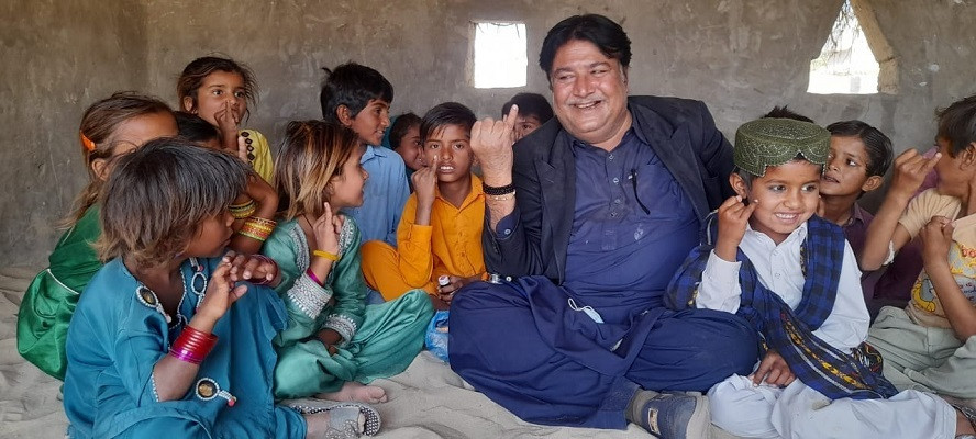 dr jewat sunder sings a rhyme about polio vaccinations with children at basic health centre in qazi wali mohammad town of sanghar district photo express