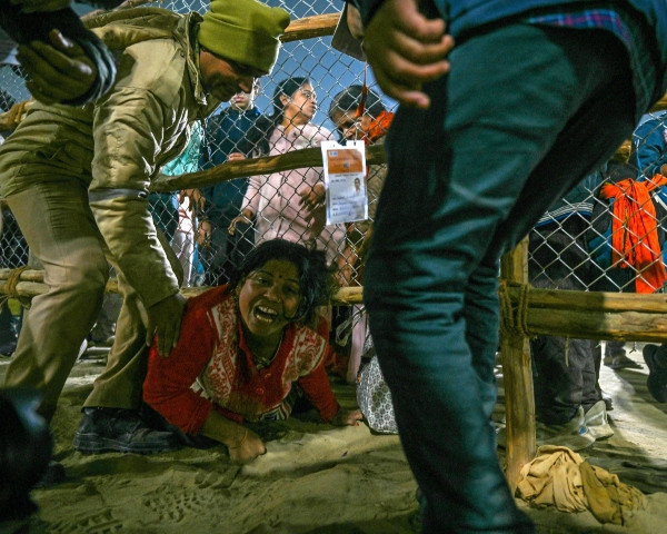 a devotee reacts at the site of a stampede amid the ongoing maha kumbh mela festival in prayagraj photo afp