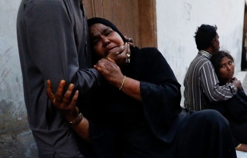 people mourn the death of a relative who was killed with others in a stampede during handout distribution at a hospital morgue in karachi pakistan march 31 2023 reuters akhtar soomro