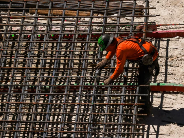 workers install steel rods at a construction site in miami florida u s march 11 2025 photo reuters workers install steel rods at a construction site in miami florida u s march 11 2025 photo reuters