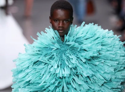 raffia dresses and feathery gowns shine in stella mccartney s show in paris raffia dresses and feathery gowns shine in stella mccartney s show in paris