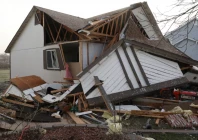 debris lies around a damaged home the morning after a tornado touched down in florissant missouri us march 15 2025 photo reuters