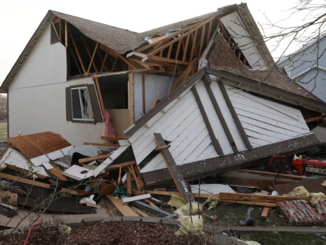 debris lies around a damaged home the morning after a tornado touched down in florissant missouri us march 15 2025 photo reuters debris lies around a damaged home the morning after a tornado touched down in florissant missouri us march 15 2025 photo reuters