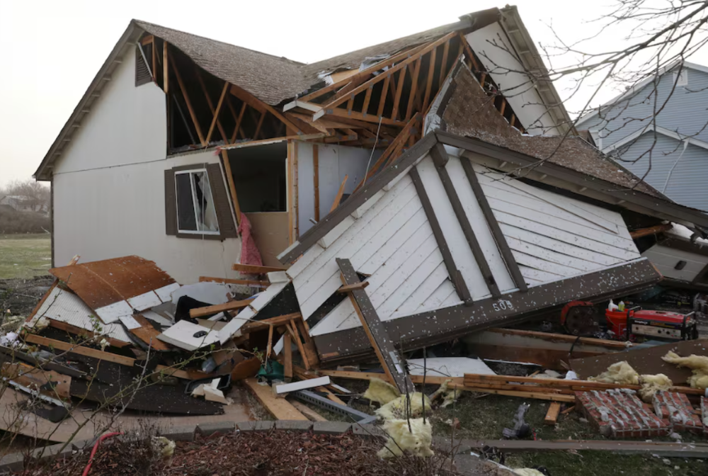 debris lies around a damaged home the morning after a tornado touched down in florissant missouri us march 15 2025 photo reuters