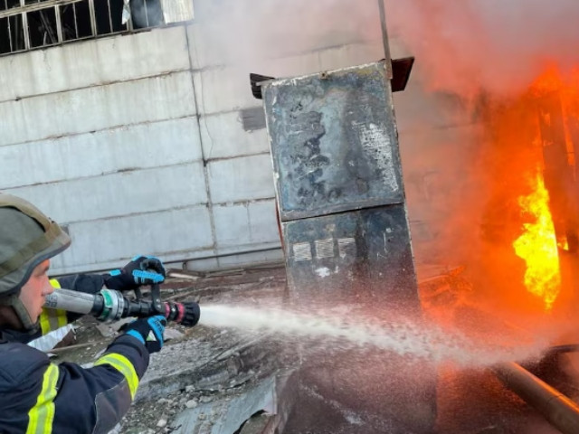 a firefighter works at a compound of power infrastructure facilities which was hit by russian missile and drone strikes amid russia s attack on ukraine at an undisclosed location in ukraine april 11 2024 press service of the state emergency service of ukraine handout via photo reuters