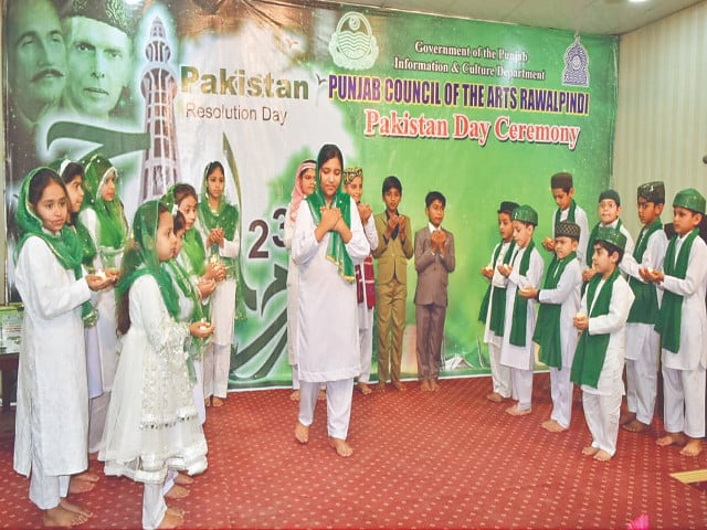 students present a tableau to mark pakistan day at the punjab arts council photo express