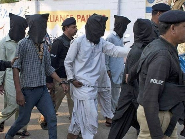 police officials take suspects arrested in an operation into custody photo express file police officials take suspects arrested in an operation into custody photo express file