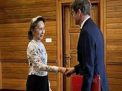 suu kyi meets red cross official suu kyi meets red cross official