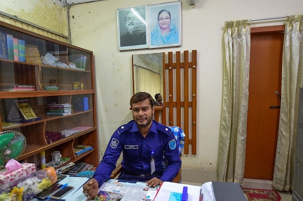 shows local chief police Ashiqur Rahman, who helped organise a proper burial for a sex worker after her death. PHOTO: AFP