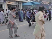 terror attack people evacuate an injured victim after a suicide bombing in swat photo afp