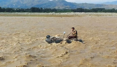 a rescue worker rows a raft while searching for survivors after tourists who were on a picnic were swept away by overflowing floodwaters in the swat river in swat valley in pakistan june 27 2025 photo reuters