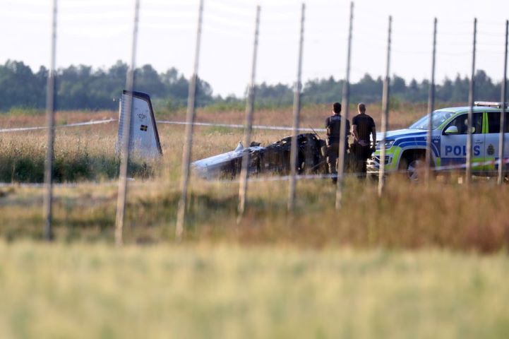 police officers observe a small aircraft that crashed at orebro airport orebro sweden july 8 2021 tt news agency jeppe gustafsson via reuters