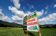 a sign stands in a field between eichenwies and eichberg on the day of the vote on a plan backed by the right wing swiss people s party svp to limit population growth to 10 million inhabitants switzerland june 14 2026 reuters
