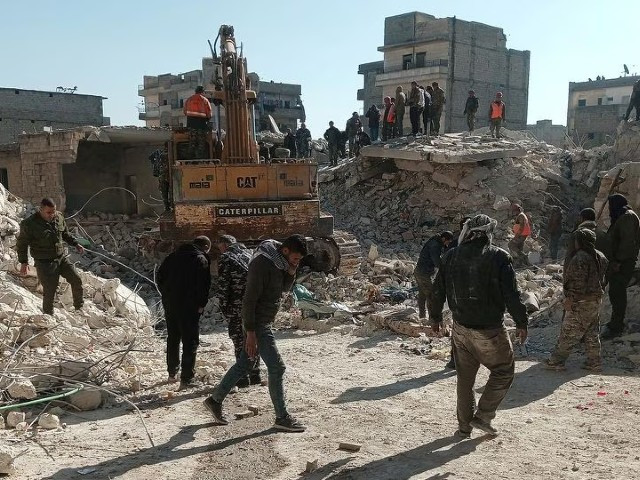 members of a rescue team work on the scene of a residential building collapse in the sheikh maksoud neighbourhood of aleppo syria january 22 2023 photo reuters