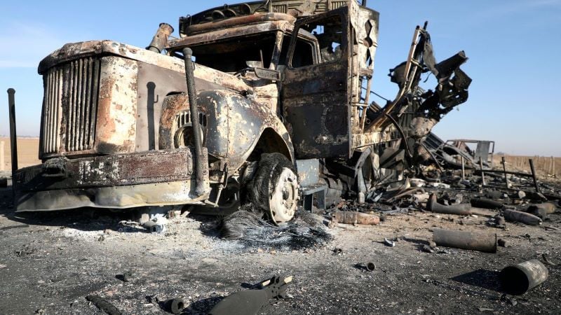 a burnt out truck near qamishli international airport photo reuters