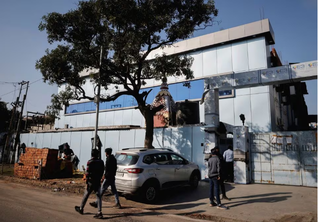 people stand outside the maiden pharmaceuticals plant that was sealed by the indian government officials in 2022 in sonipat in the northern state of haryana india february 2023 photo reuters